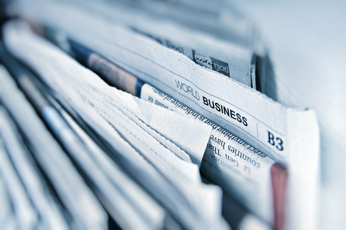 A close up of insider newspapers in a folder.