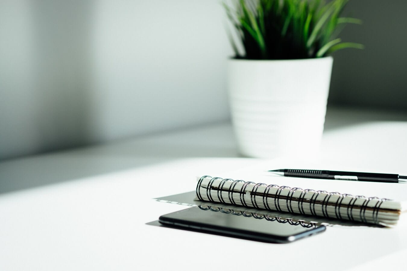 A notebook and pen on a table.