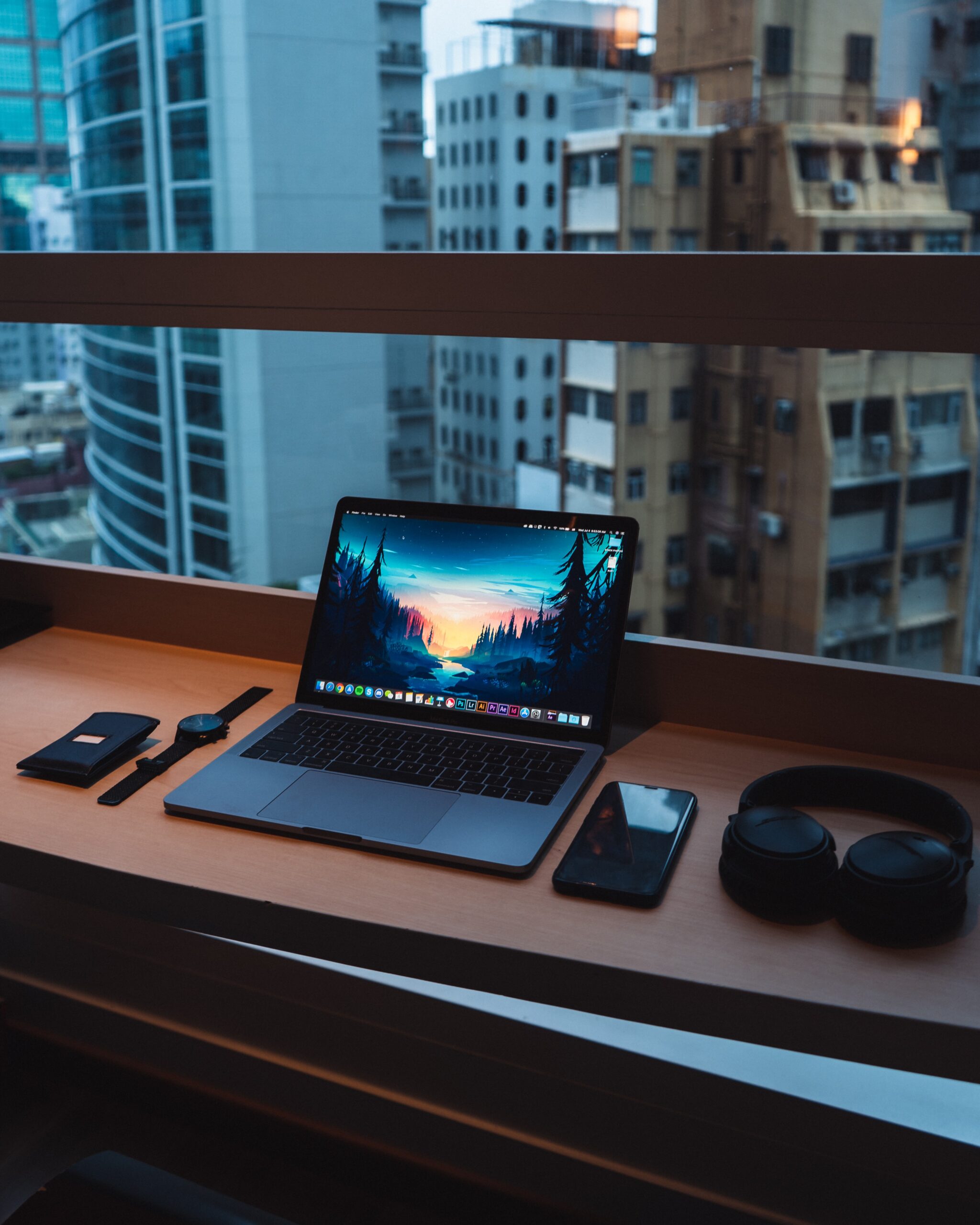 A computer on a desk in a city background displaying Making Tax Digital delays on the screen.